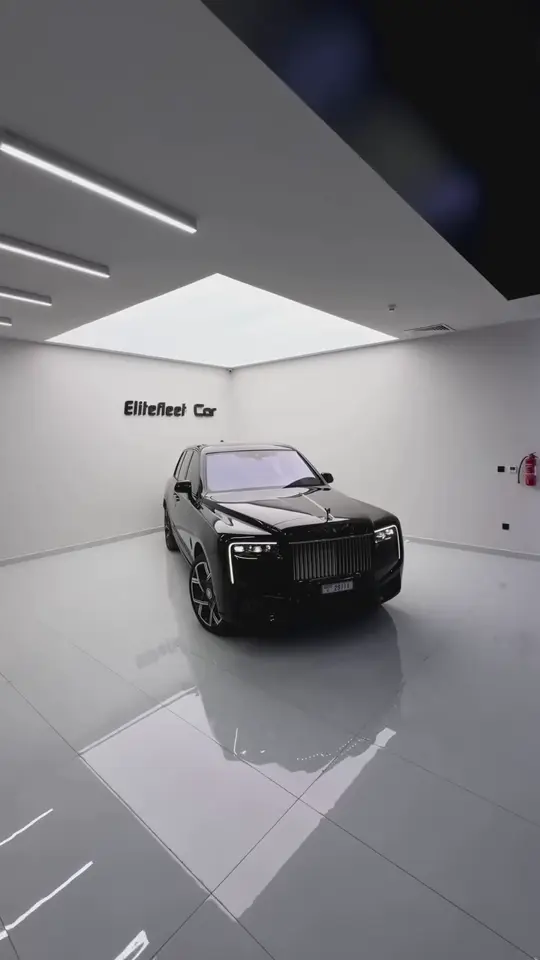 Black Rolls-Royce Cullinan with a turquoise interior in the EliteFleet showroom