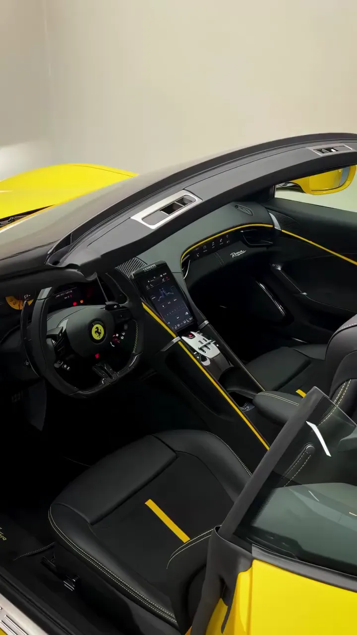The Roma Spider's cockpit, black leather with yellow stitching